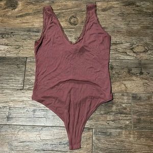 Mauve low cut tank top body suit with lace detail